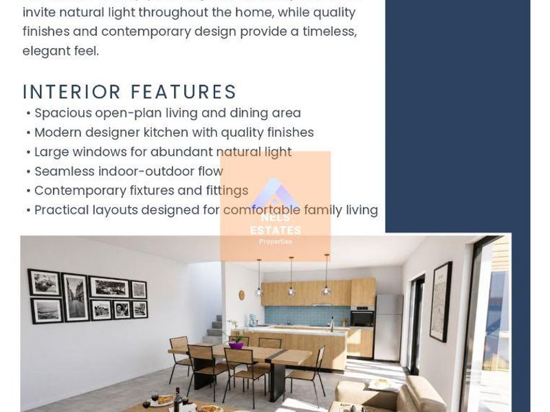 A bright open-plan living, dining, and kitchen area featuring modern cabinetry, a central island, and large sliding doors providing seamless indoor-outdoor flow.