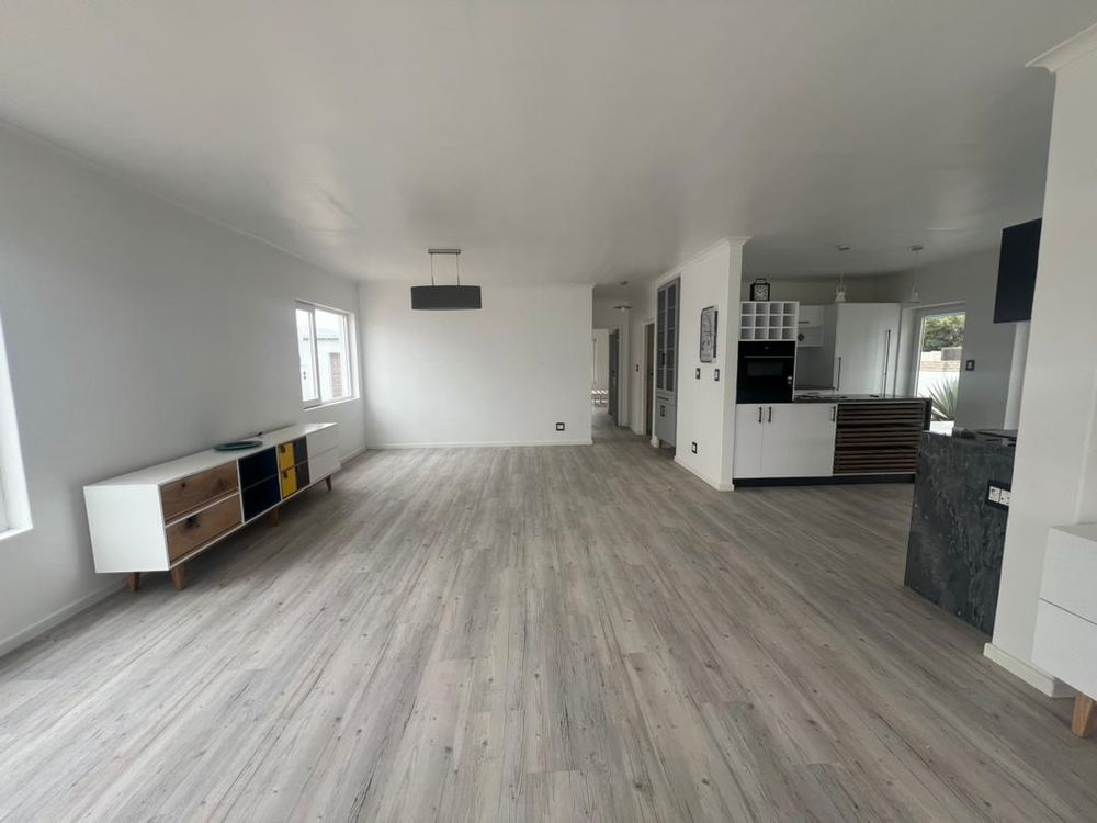 Open-plan kitchen, lounge and dining room upon entry