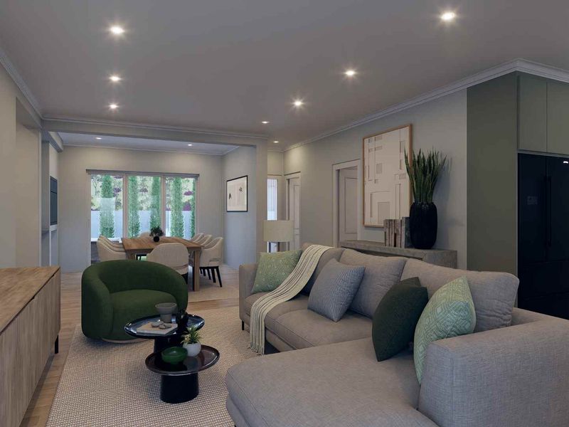 Modern open-plan living area featuring a contemporary kitchen with island, recessed lighting, and seamless flow into the dining and lounge spaces.