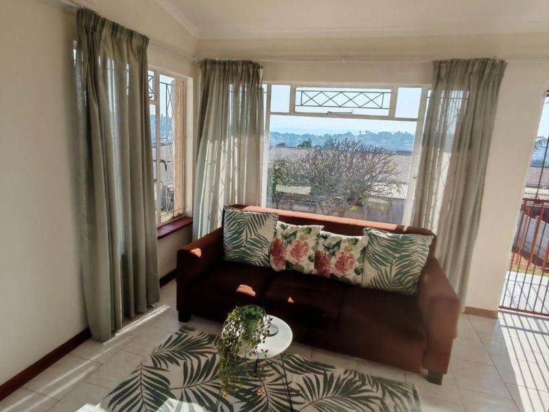 Three-Bedroom Ocean View Starter Home with Inland views nestled in Spacious Garden - Photo 4