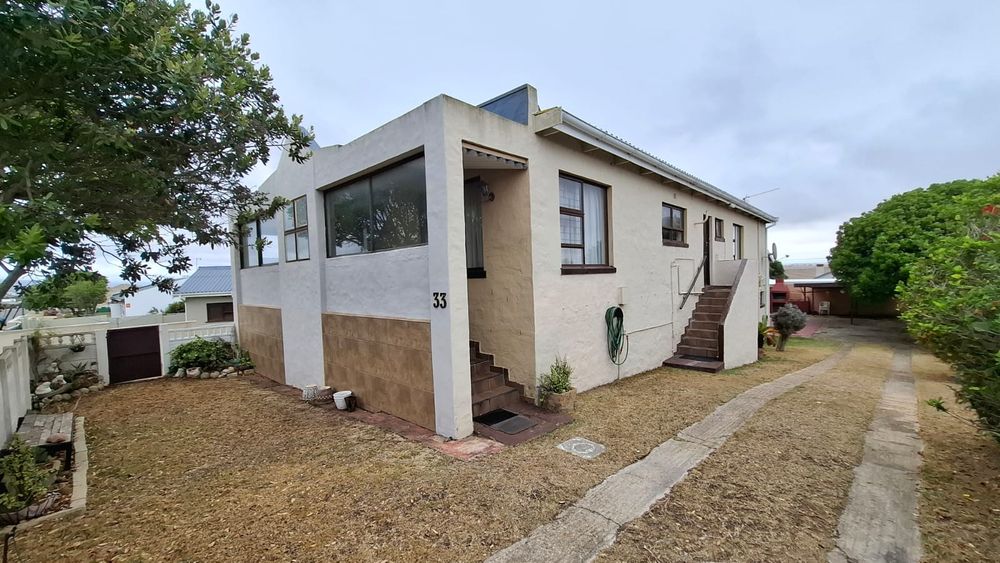View down driveway towards garages