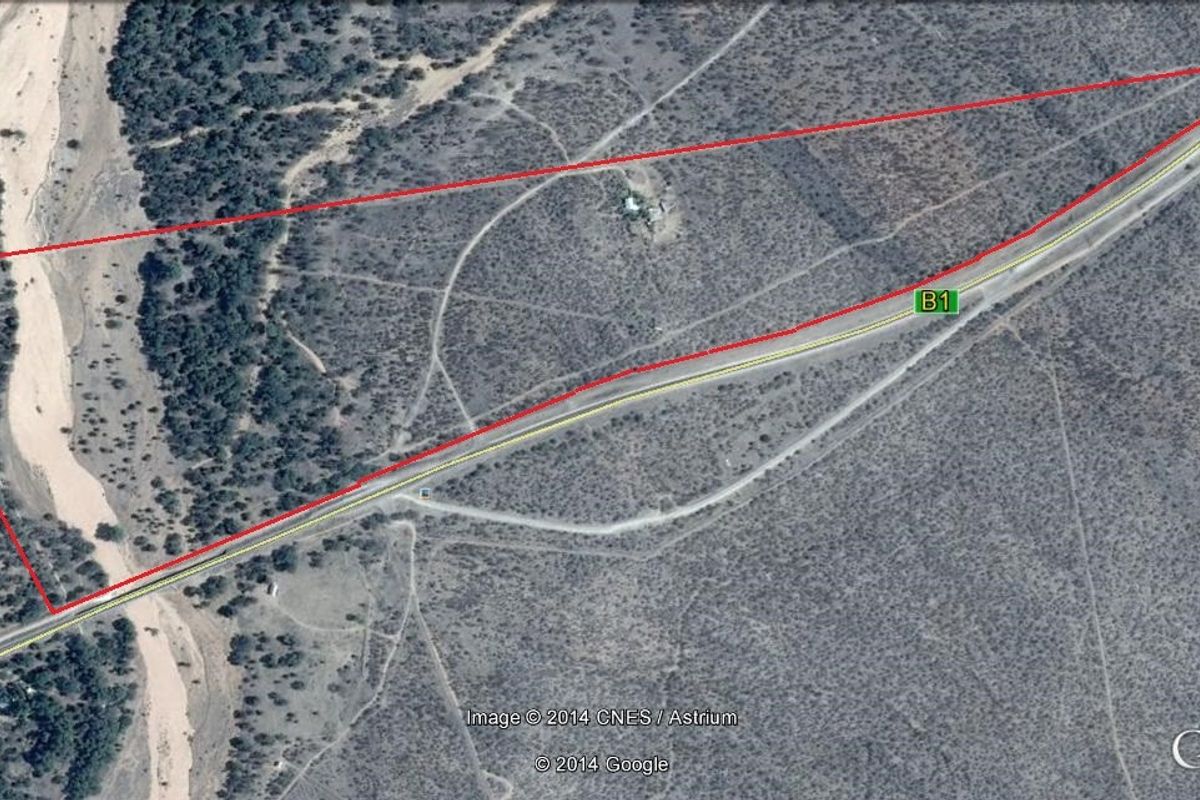 Aerial view of a vacant residential land parcel showing property boundaries and proximity to the B1 highway.
