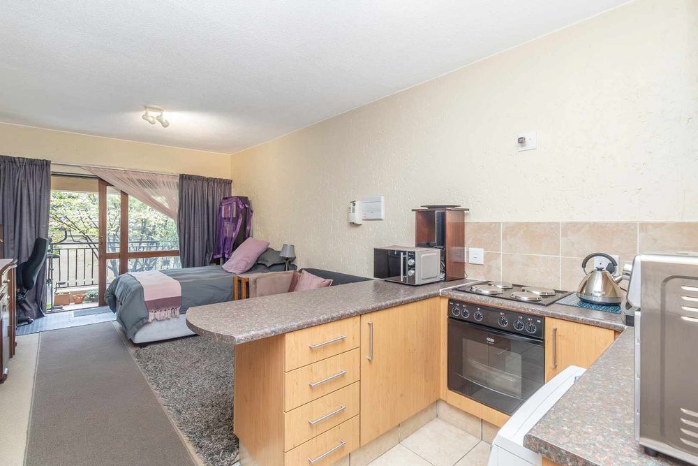 Kitchen layout gives you counter space to cook and entertain and see your tv or the birds on the balcony