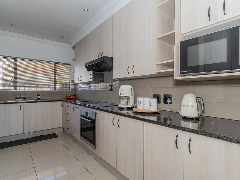 Modern 3-Bedroom Entertainer’s Dream Home with Jacuzzi Room & Heated Pool in Birch Acres - Photo 8