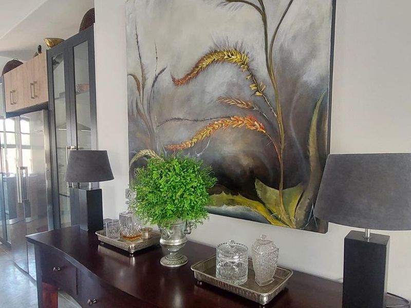 A well-maintained living area featuring polished concrete floors and built-in cabinetry, creating a modern and sophisticated atmosphere.