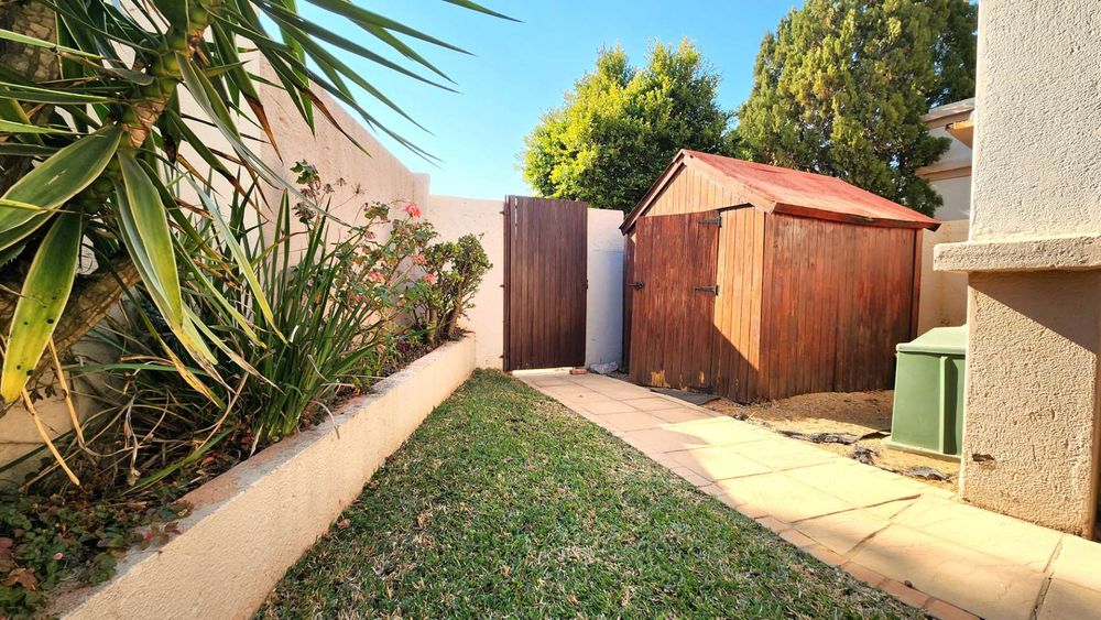 Garden shed to the side of the house.