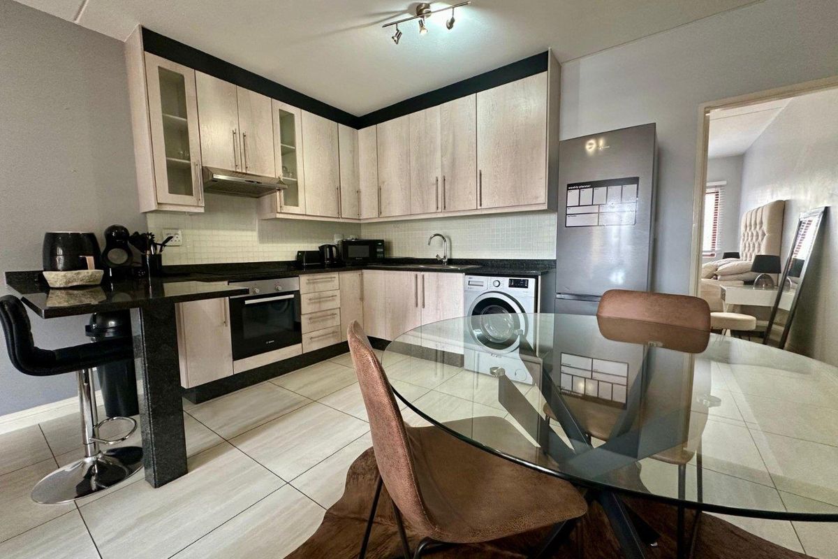 A MODERN ONE BEDROOM FURNISHED APARTMENT - Photo 3