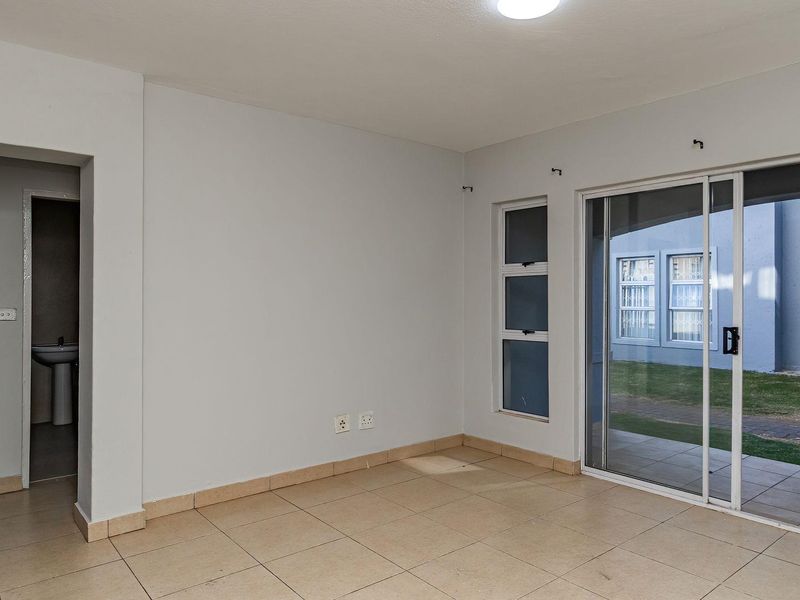 Your Ideal Home: Ground Floor Unit with Patio & Pool Access - Photo 7