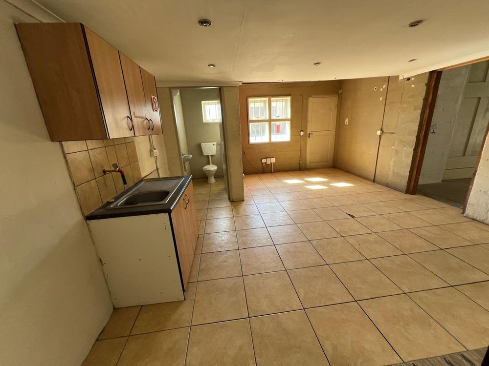 Office 2 with sink, WC and door leading outside