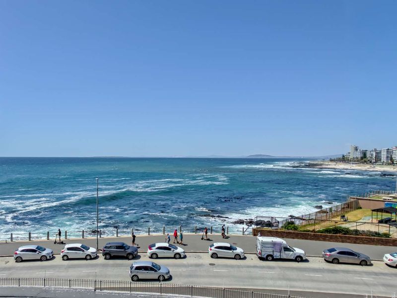 A clear, elevated view of the ocean and coastline, showcasing the property's prime location and proximity to the sea.