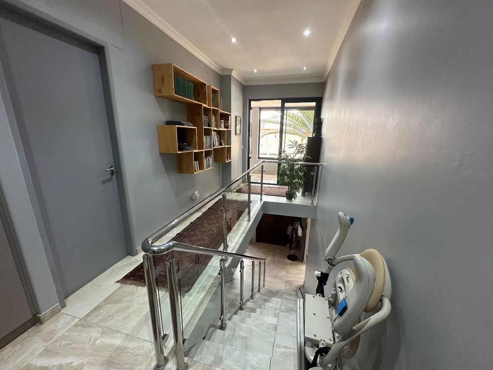 Stairs leading upstairs to office and bedrooms