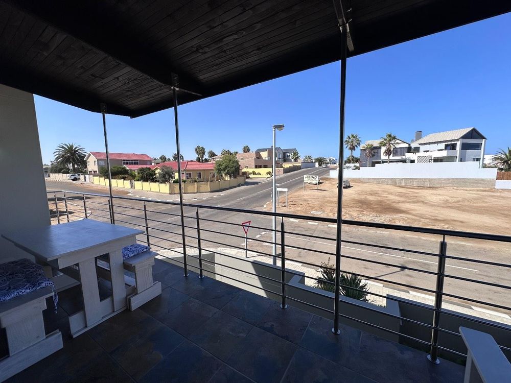 Main Flat, 2 ensuite bedrooms, open plan kitchen with lounge and inside barbecue and balcony.