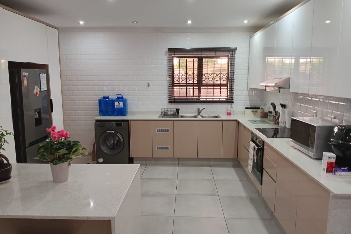 Step into comfort and modern convenience with this beautifully presented 3-bedroom home, perfectly designed for easy living. Fully tiled throughout, this home o - Photo 4