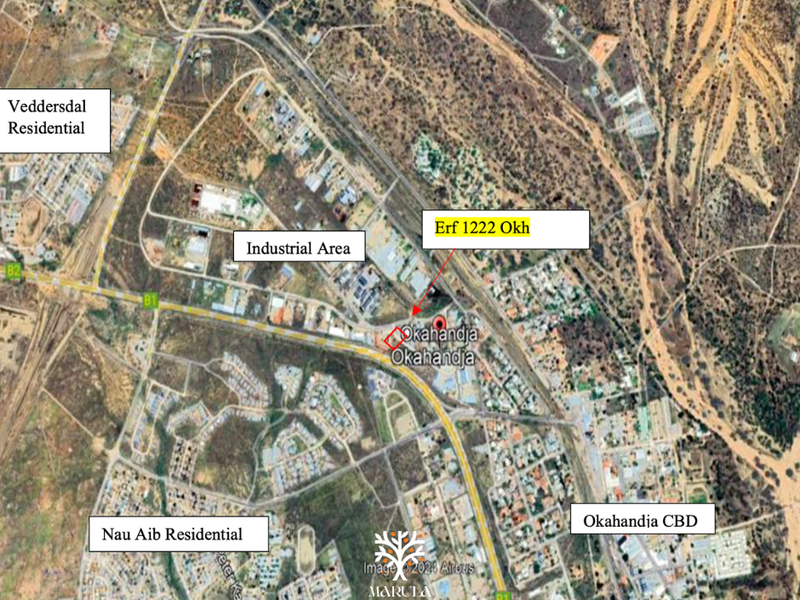 Aerial satellite view showing the location of Erf 1222 Okh in relation to the surrounding industrial area, residential zones, and Okahandja CBD.
