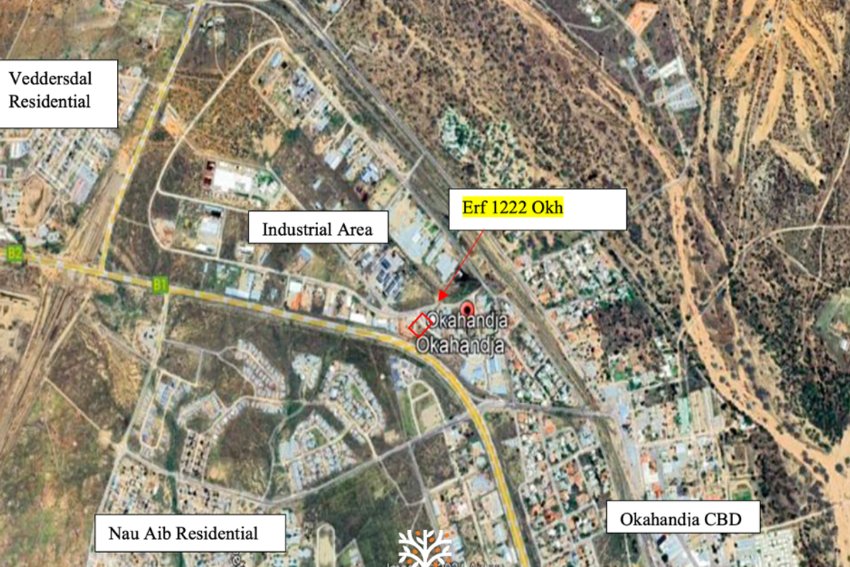Aerial satellite view showing the location of Erf 1222 Okh in relation to the surrounding industrial area, residential zones, and Okahandja CBD.