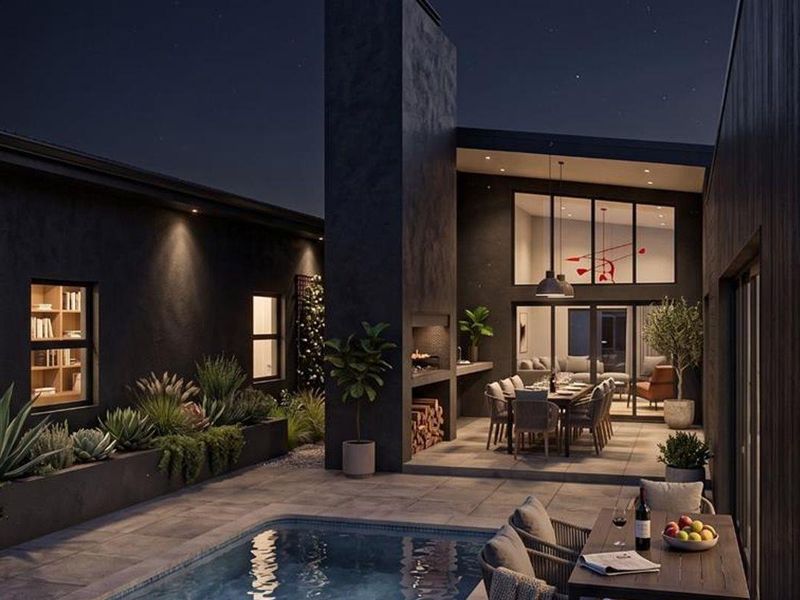 Modern outdoor entertainment area featuring a built-in fireplace, tiled patio, and swimming pool, seamlessly connected to the interior living space through large glass doors.
