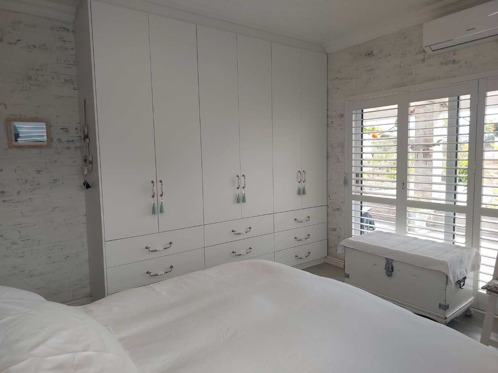 Main bedroom with ample built in cupboards