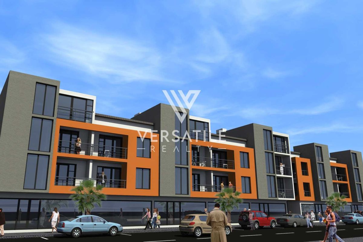 A modern multi-story retail and residential building featuring contemporary architectural design, large glass windows, and private balconies.