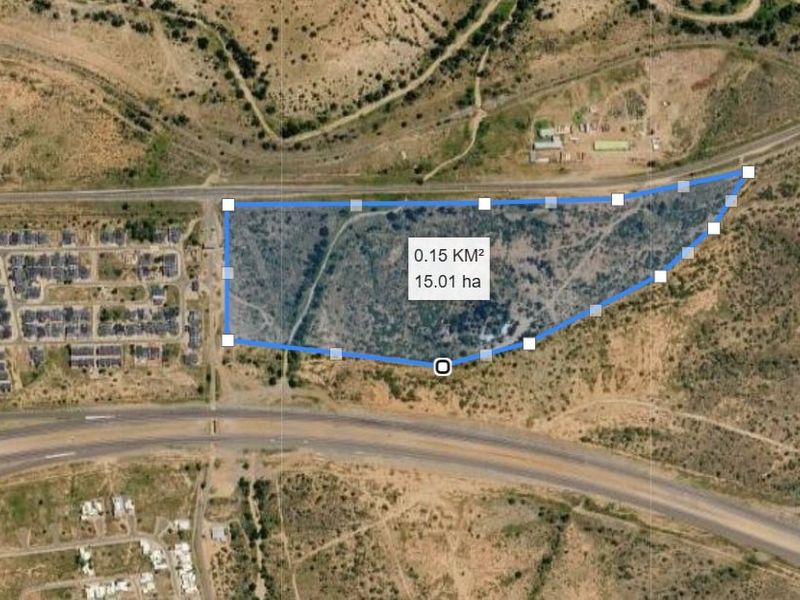 An aerial satellite view of a 15.01 hectare vacant residential land parcel, showing its boundaries and surrounding road infrastructure.