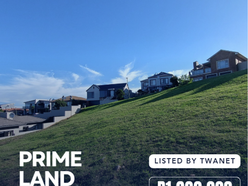 A sloped residential vacant land plot situated in a developed estate, offering potential for a tiered architectural design.