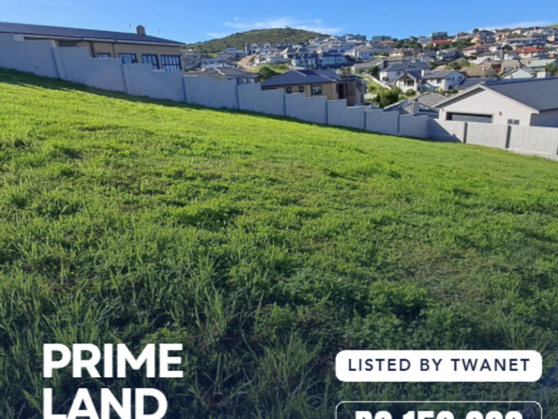 A vacant residential plot of land featuring a gentle slope and established boundary walling in a developed neighborhood.