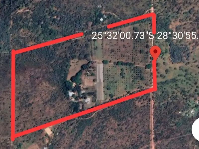 An aerial satellite view showing the property boundary and surrounding landscape of the farm.