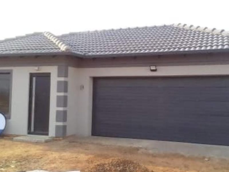 Front elevation of a modern single-story house featuring a double garage, tiled roof, and neutral exterior finishes.