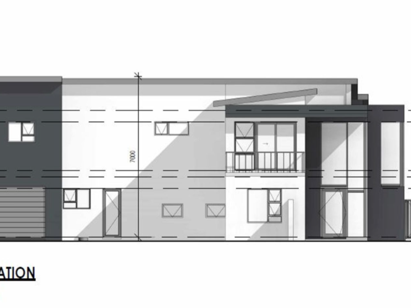 Architectural south elevation drawing showing the building facade, garage, and window placements for the proposed house design.