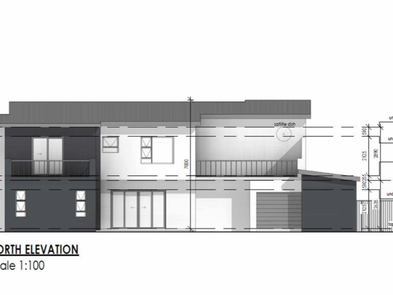 Architectural north elevation drawing showing the building facade, including balcony, garage, and window placements with height measurements.