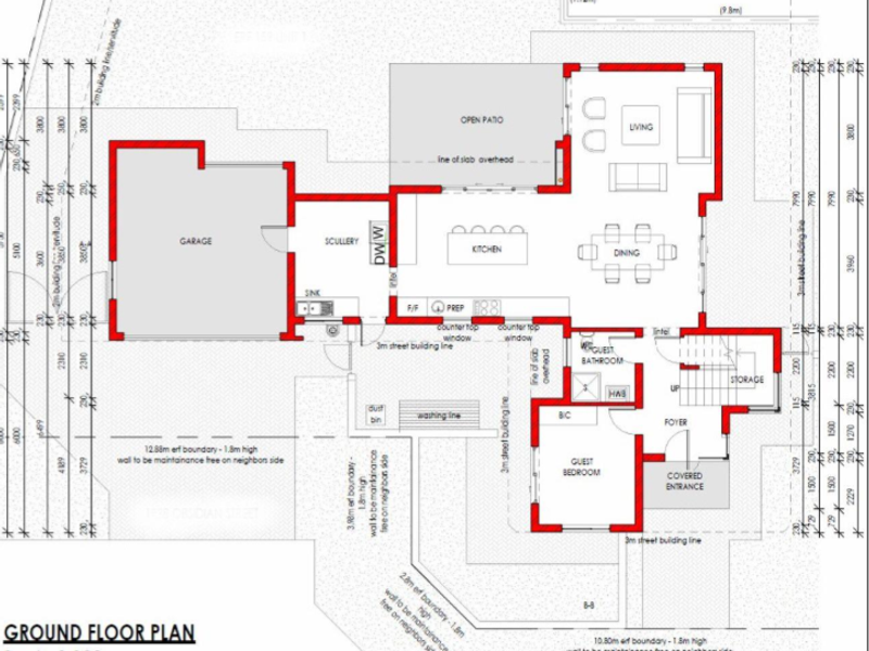 A detailed ground floor architectural plan showing the layout of the garage, kitchen, living areas, guest bedroom, and entrance.