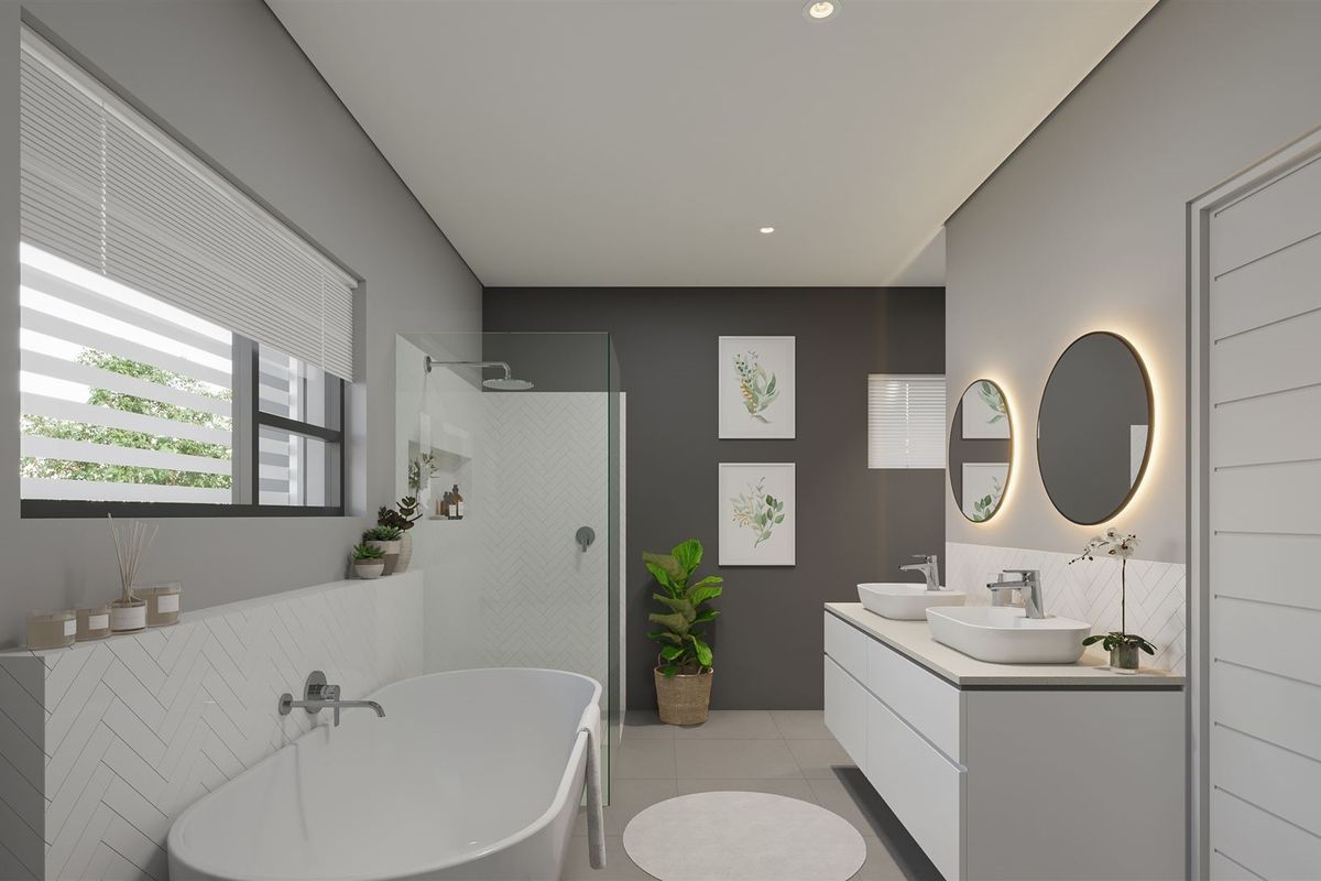 Modern bathroom featuring a freestanding bathtub, walk-in shower with herringbone tiling, and a double vanity with backlit circular mirrors.