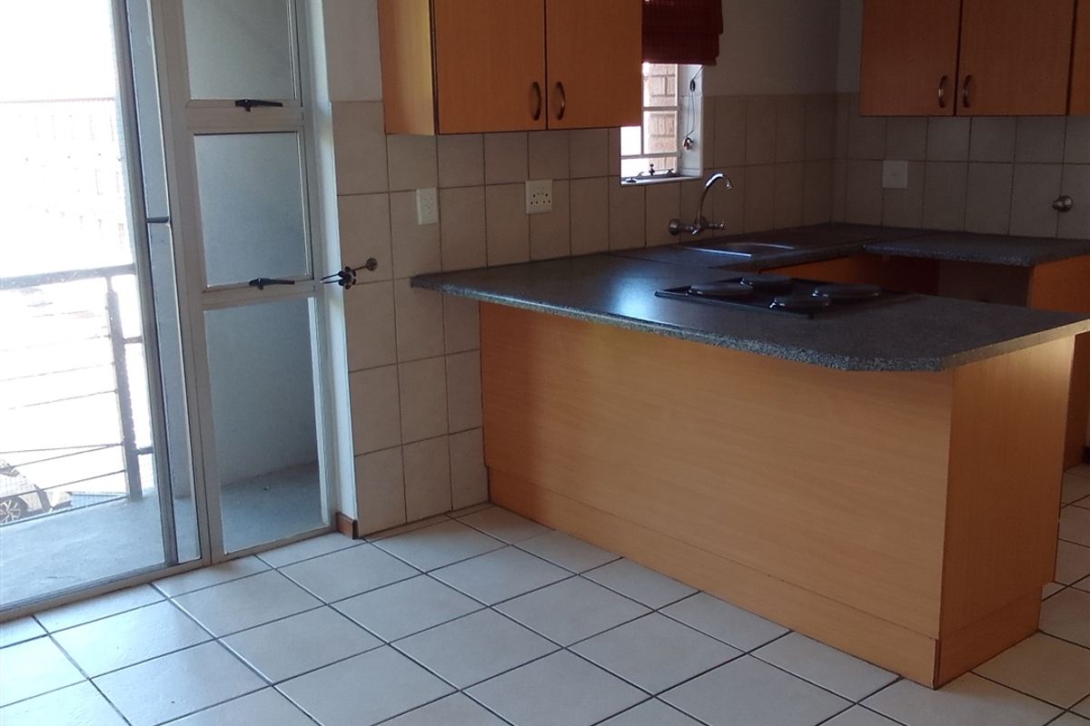 Spotless Duplex Unit with Balcony and Workstation - Photo 2