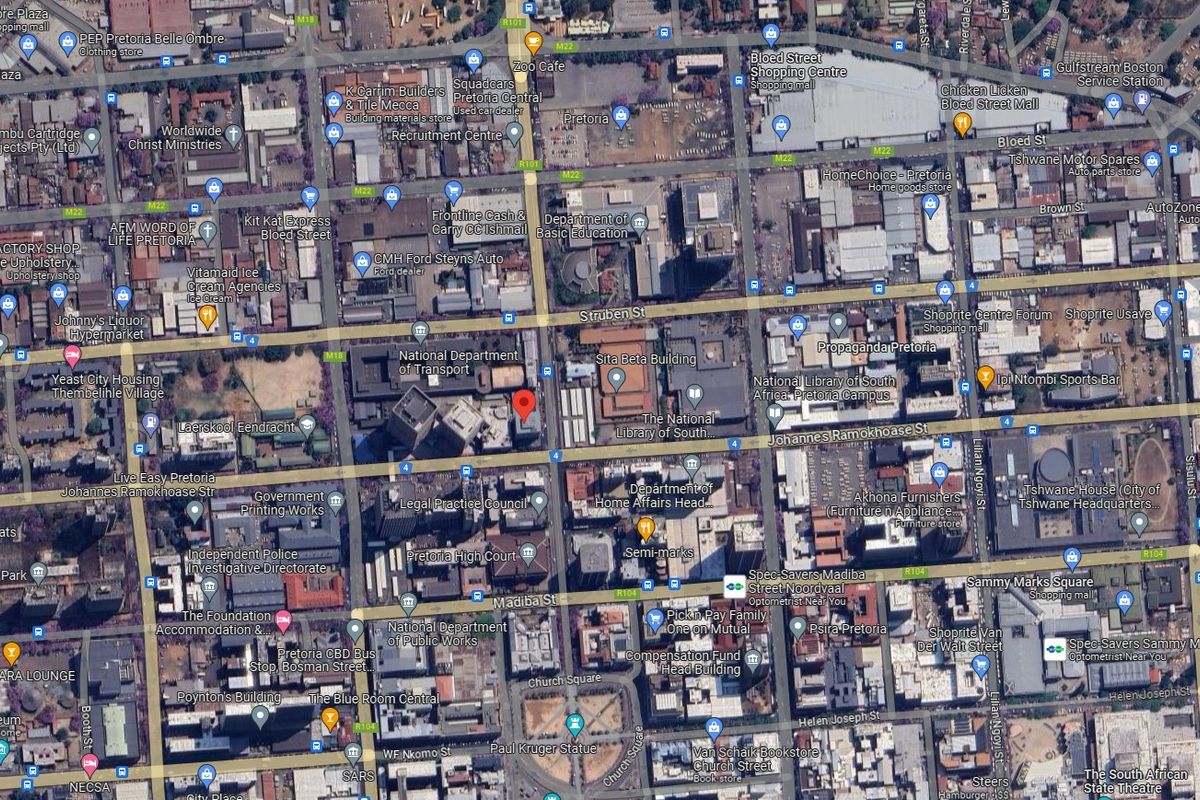 An aerial satellite view of the Pretoria central business district showing surrounding infrastructure, streets, and commercial buildings.