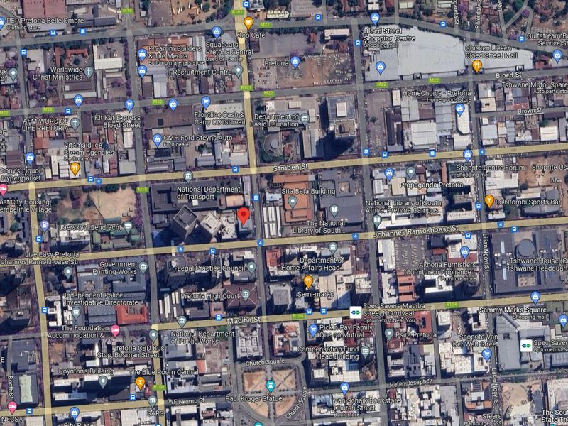 An aerial satellite view of the Pretoria central business district showing surrounding infrastructure, streets, and commercial buildings.