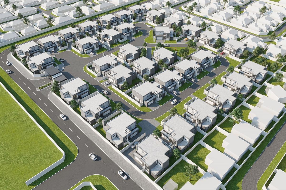 An aerial view of a modern residential estate featuring multiple detached houses, paved road networks, and landscaped surroundings.