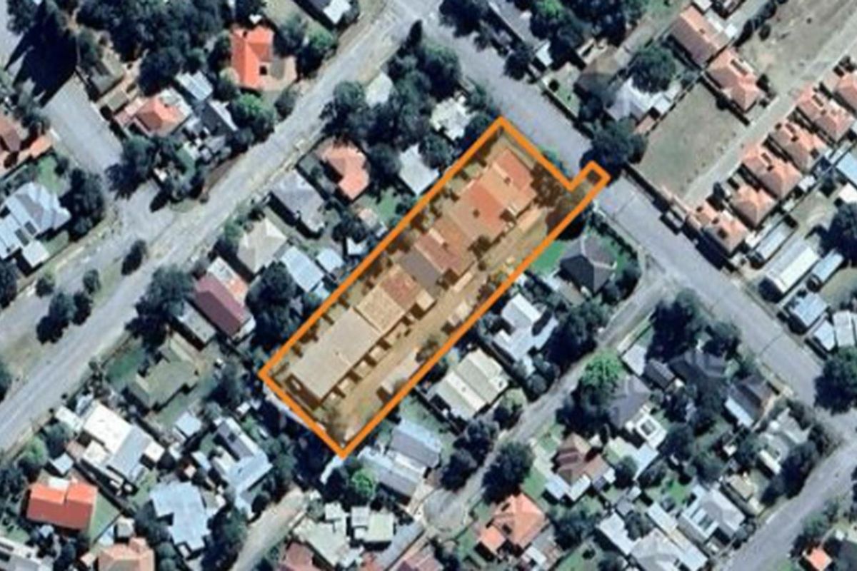 Aerial view of the townhouse complex property boundary within the surrounding residential neighbourhood.