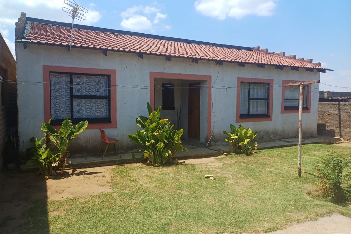 Charming 3-bedroom home with additional outside rooms- ideal for family living or investment - Photo 2