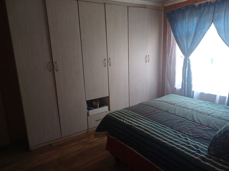 Charming 3-bedroom home with additional outside rooms- ideal for family living or investment - Photo 8