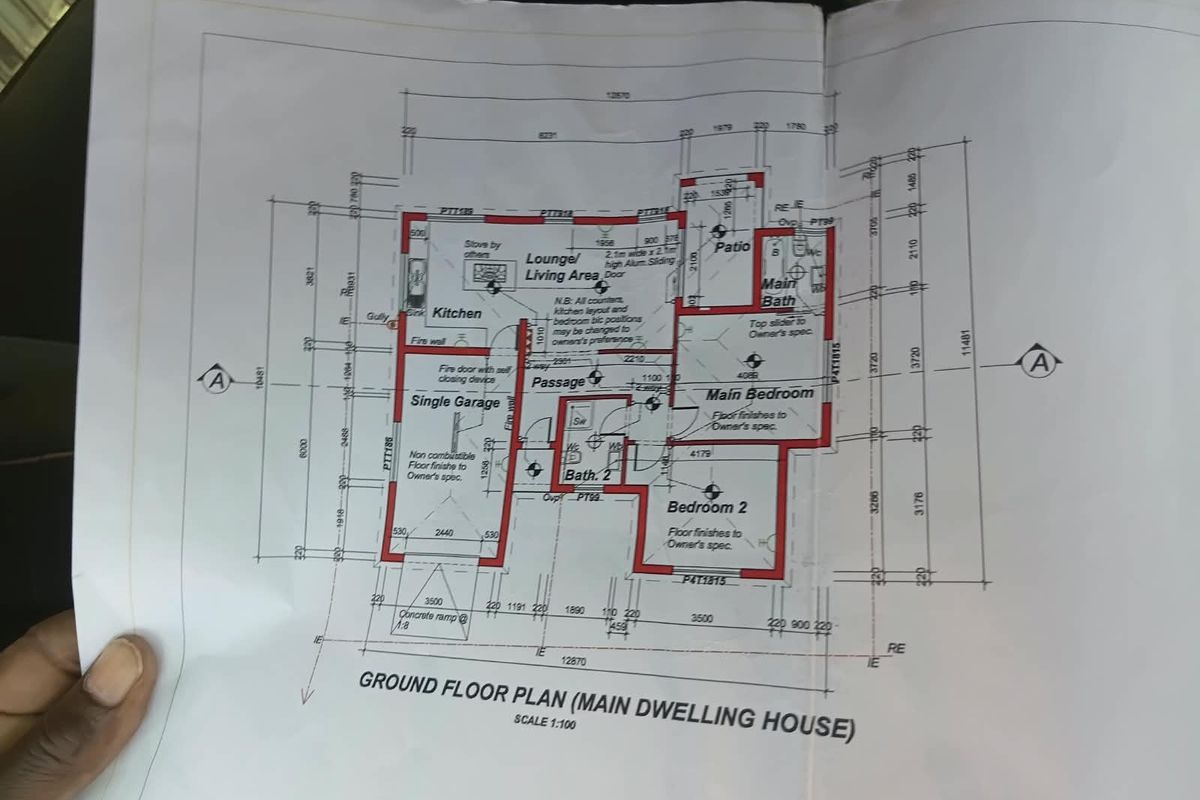A detailed ground floor plan for a residential dwelling featuring a single garage, two bedrooms, two bathrooms, and an open-plan kitchen and living area.