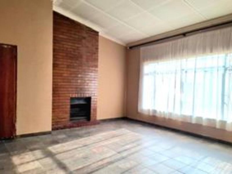 Spacious 4-Bedroom Family Home with Great Potential in a Neat Area - Photo 1
