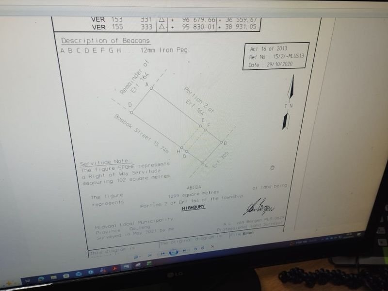 A digital photograph of a surveyor's diagram showing the property boundaries and servitude details for the residential land.