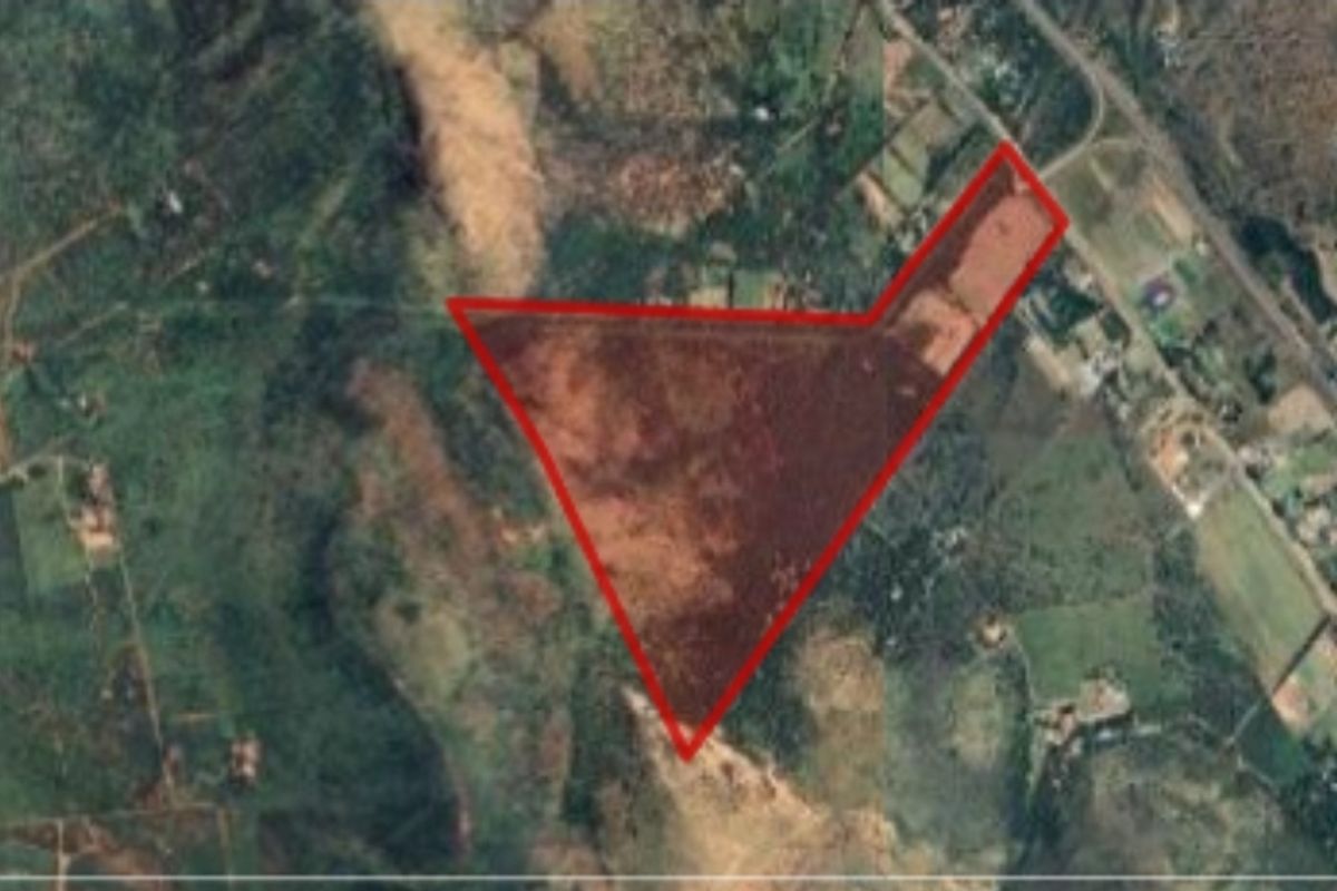 An aerial satellite view showing the boundary outline of the farm property.