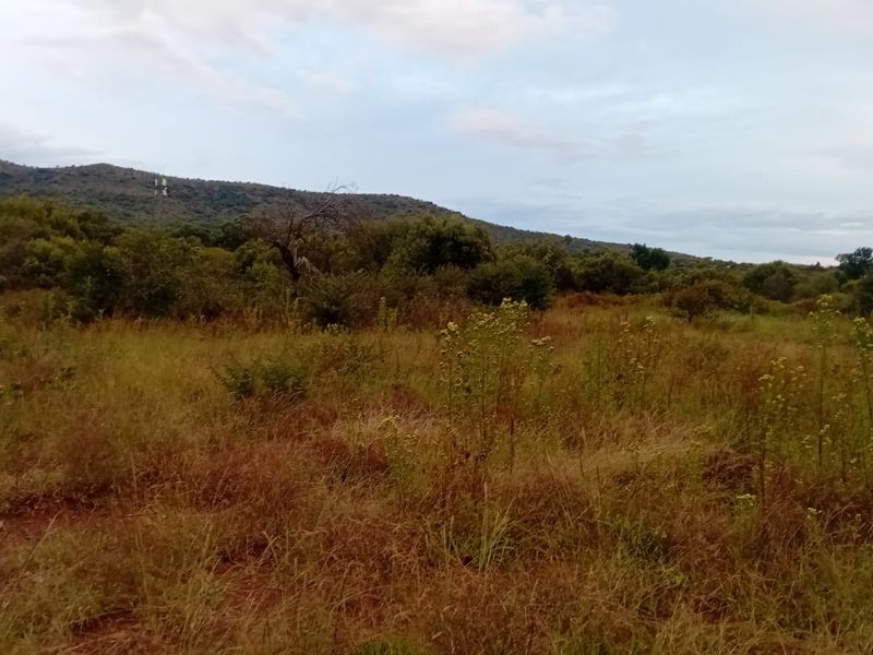 A scenic view of the natural landscape and mountainous terrain surrounding the vacant residential property.