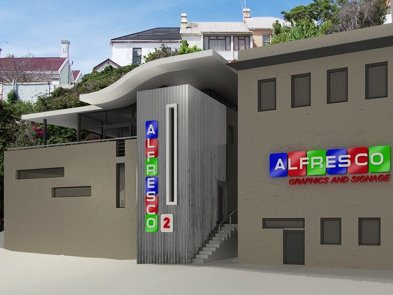 Modern commercial building facade featuring contemporary metal cladding, architectural signage, and an external staircase entrance.