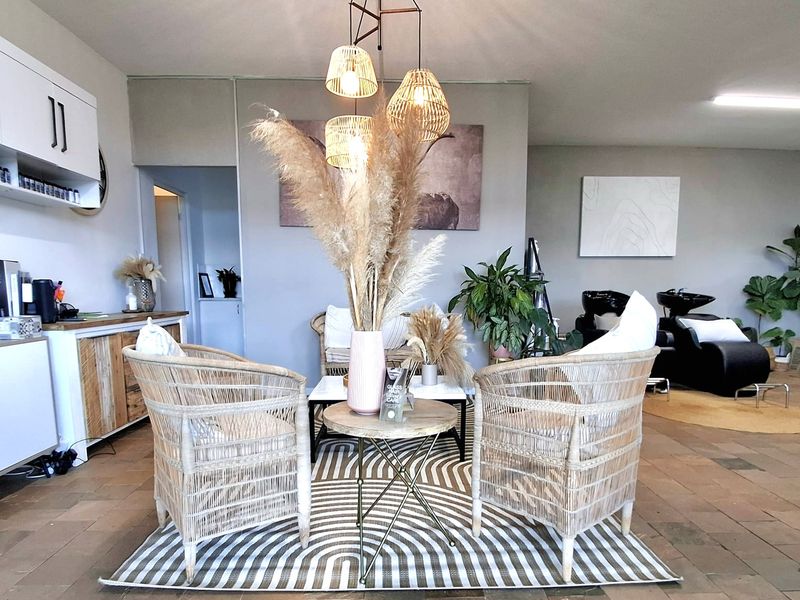 A well-maintained office space featuring tiled flooring, built-in cabinetry, and a professional layout suitable for a salon or commercial workspace.