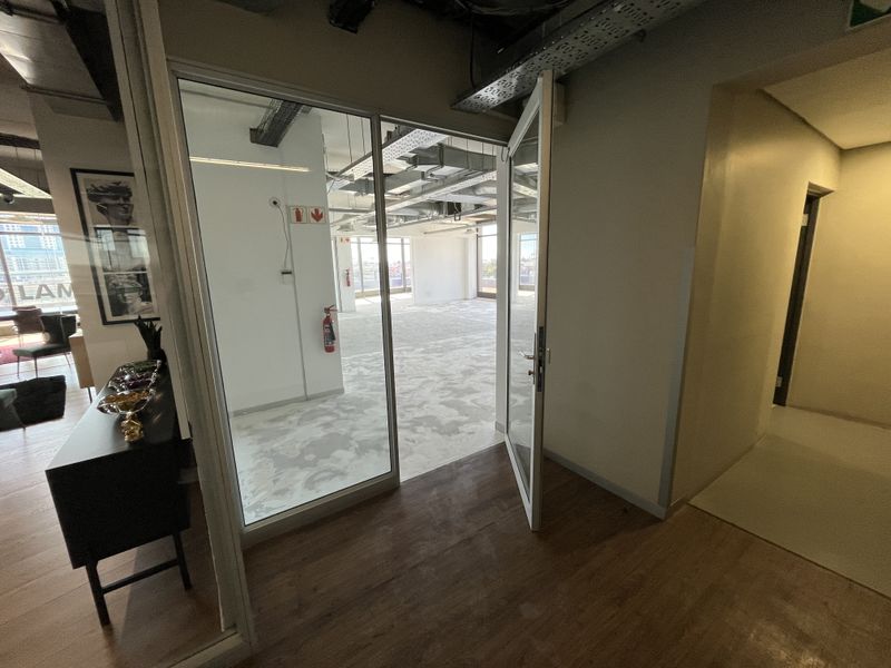 Panoramic Corner Office with Wrap-Around Balcony in The District - Photo 5