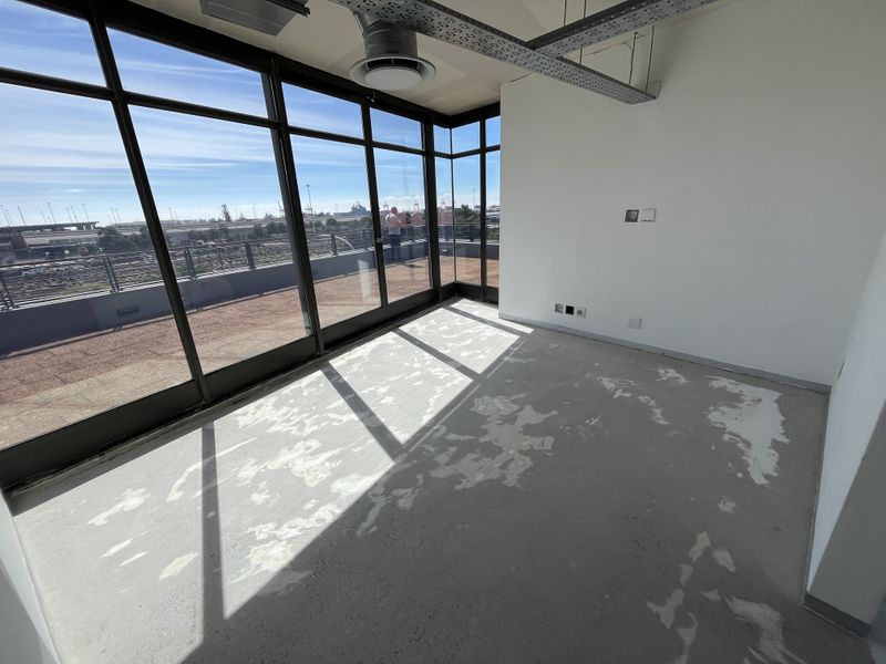 Panoramic Corner Office with Wrap-Around Balcony in The District - Photo 9
