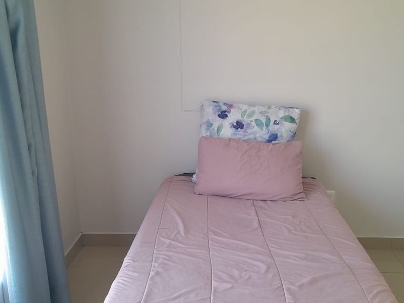 A simple bedroom featuring neutral tiled flooring and a clean, minimalist aesthetic, ready for personalization.
