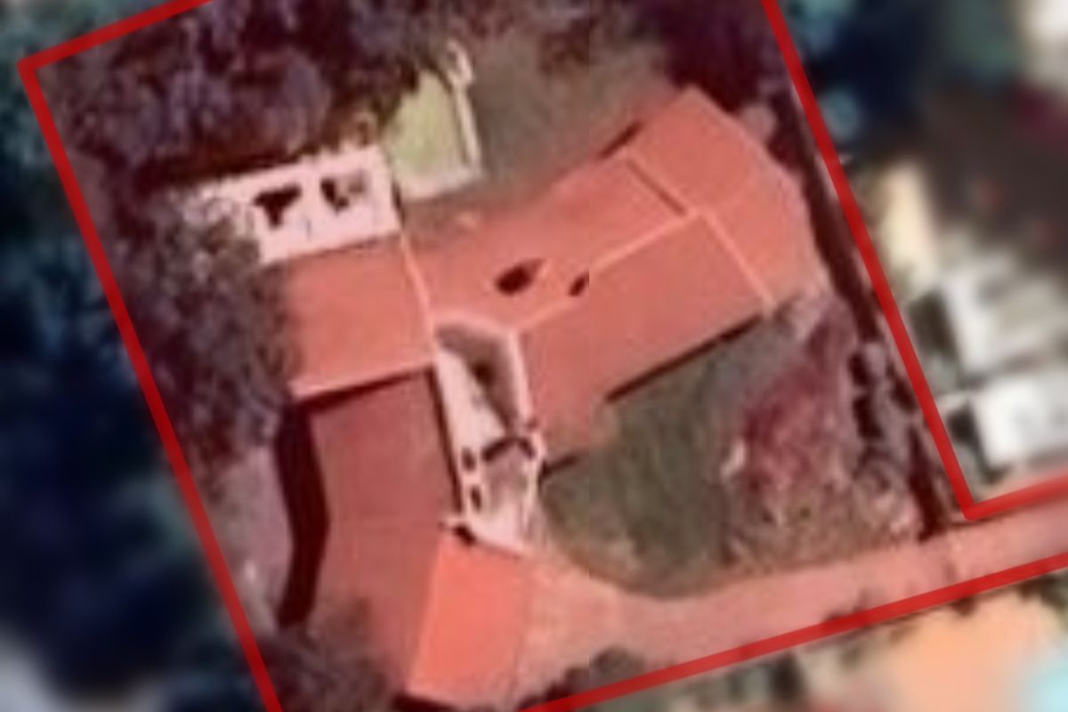 An aerial satellite view of the property showing the roof structure and site boundaries.