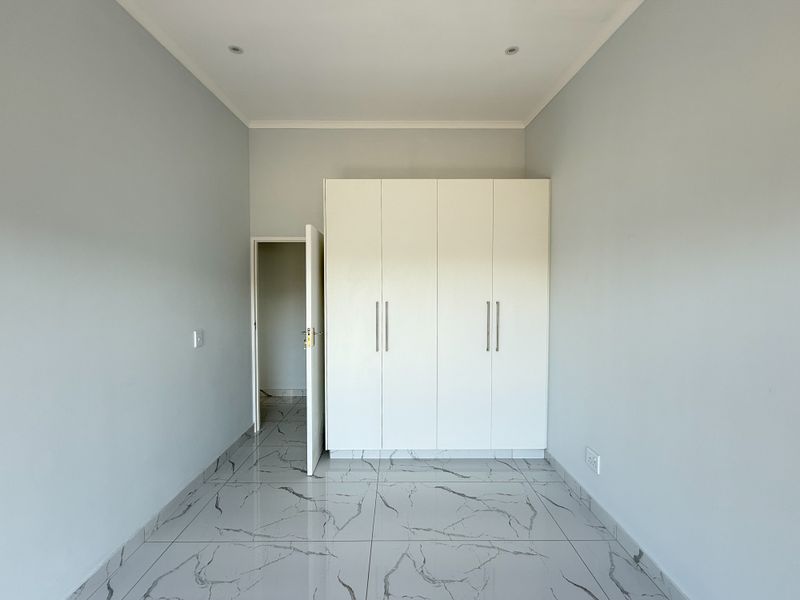 Modern 4-Bedroom Home in Palm Lakes Estate – Contemporary Living in a Natural Setting - Photo 9